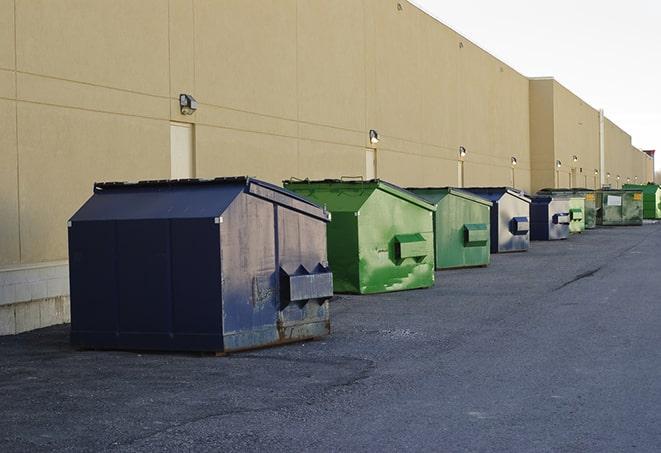 construction waste bins waiting to be picked up by a waste management company in Bauxite